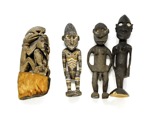 Four Papua New Guinea carved and