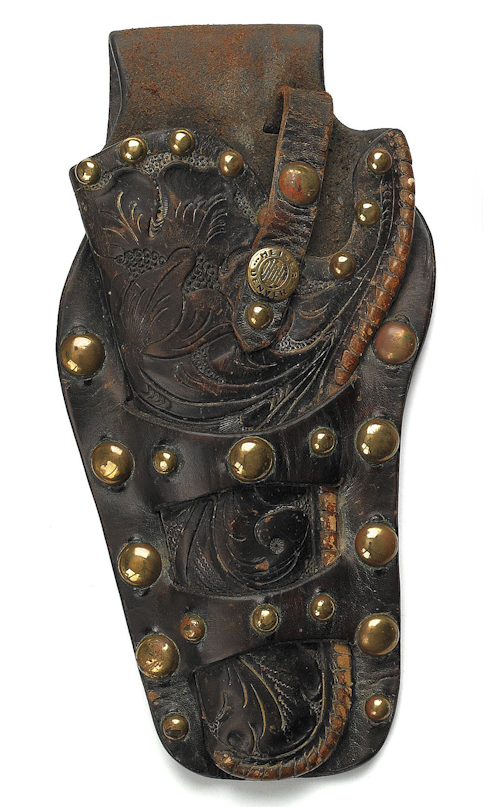 Leather tooled holster with a brass