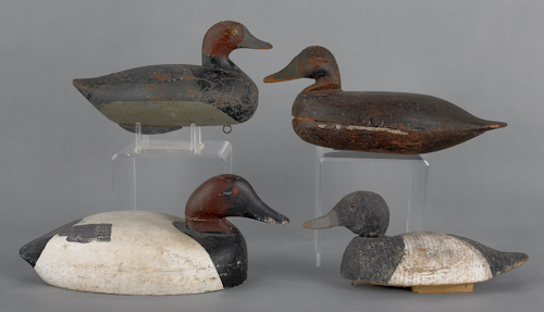 Four carved and painted duck decoys