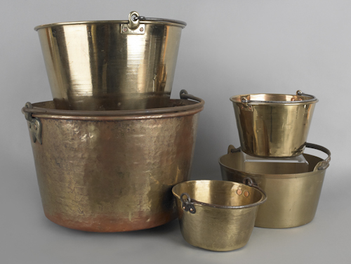 Five brass pots with iron swing