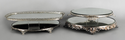 Four silver plated mirrored plateaus.