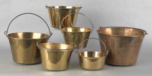 Six brass pots with iron swing