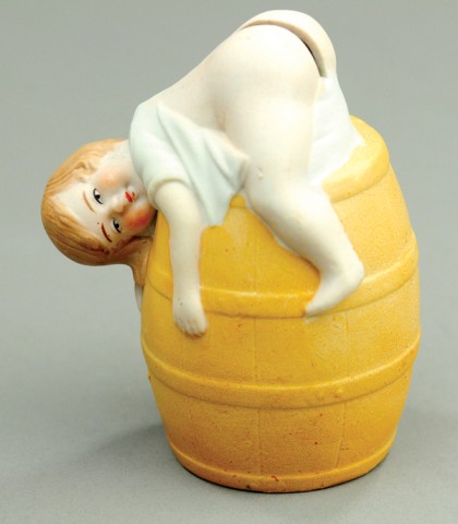 RESTING BABY ON BARREL STILL BANK Porcelain