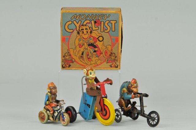 GROUPING OF MONKEY CYCLIST TOYS Lithographed
