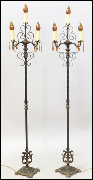 PAIR OF WROUGHT IRON TORCHIERES.