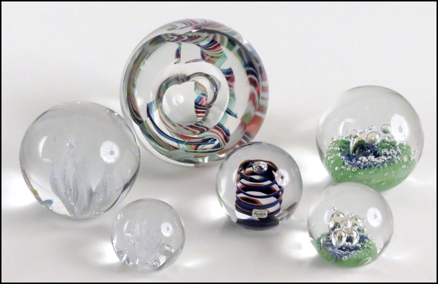 FIVE KOSTA GLASS PAPERWEIGHTS.