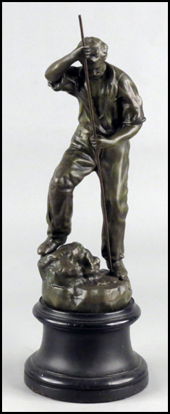 PATINATED METAL FIGURE OF A MAN.