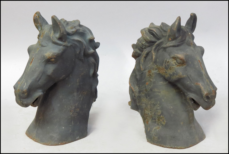 PAIR OF CAST IRON HORSE HEADS.
