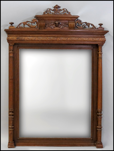CONTINENTAL CARVED OAK MIRROR.