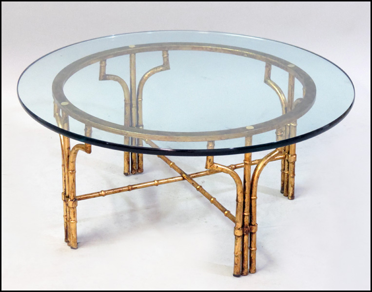 BRASS AND GLASS TOP COCKTAIL TABLE.