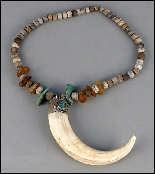 CARVED BONE TRIBAL NECKLACE. With