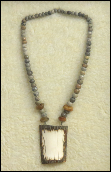 FRAMED TRIBAL NECKLACE. Bone amber