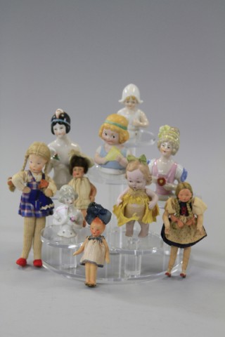 LOT OF FIVE SMALL DOLLS AND FIVE