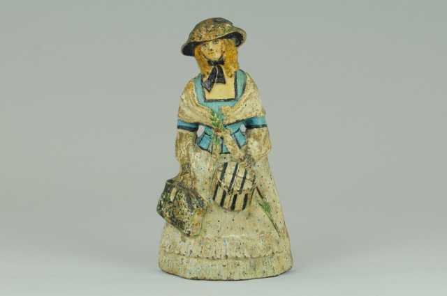 LADY WITH HAIRBOX AND CARPET BAG DOORTSTOP