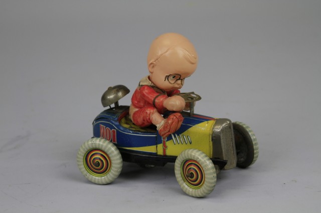 CELLULOID BOY RIDING CAR Pre war 179f0e