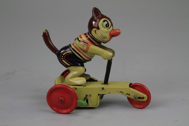 CAT RIDING SCOOTER Lithographed
