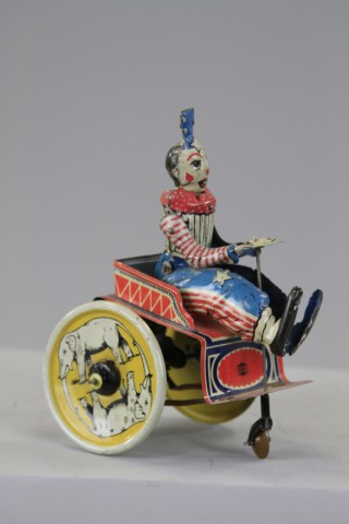 CLOWN ON CART Gundka Germany lithographed