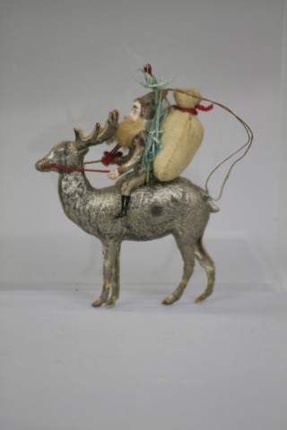 SANTAS ELF ON REINDEER DRESDEN ORNAMENT