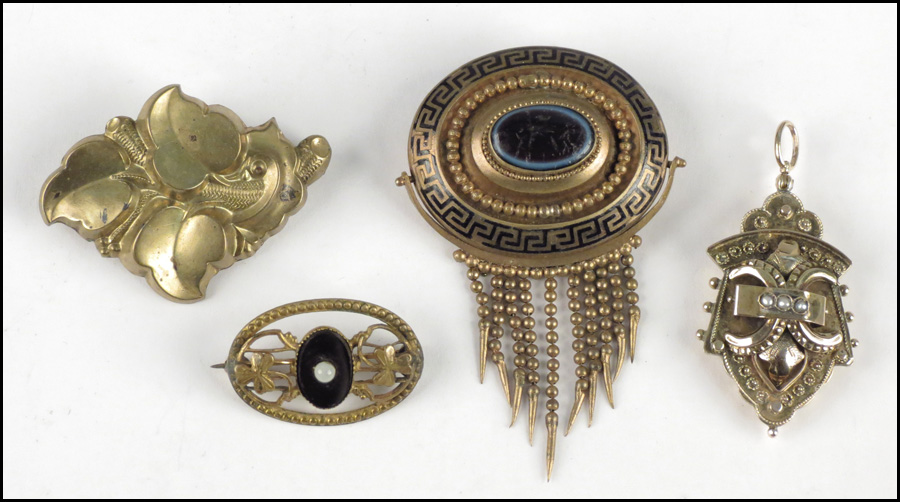 FOUR VICTORIAN GOLD FILLED BROOCHES.