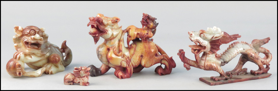 THREE CARVED SOAPSTONE DRAGONS.