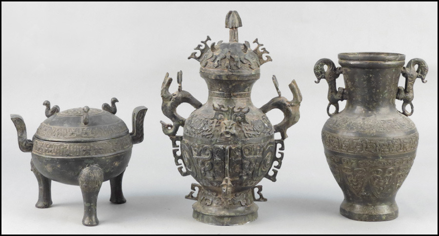 TWO CHINESE BRONZE COVERED VESSELS.