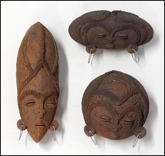 THREE AFRICAN CLAY HEADS. Largest