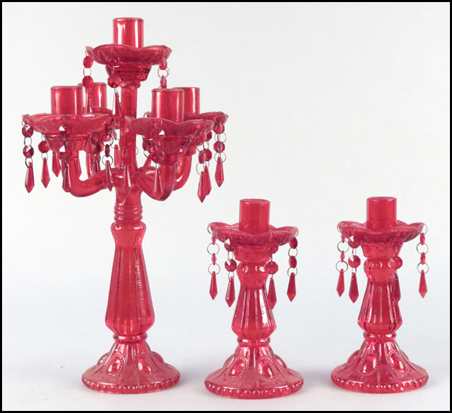 FIVE PAIRS OF PAINTED WOOD CANDLESTICKS.