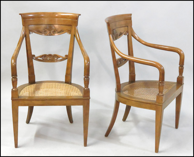 PAIR OF CARVED MAHOGANY OPEN ARMCHAIRS.