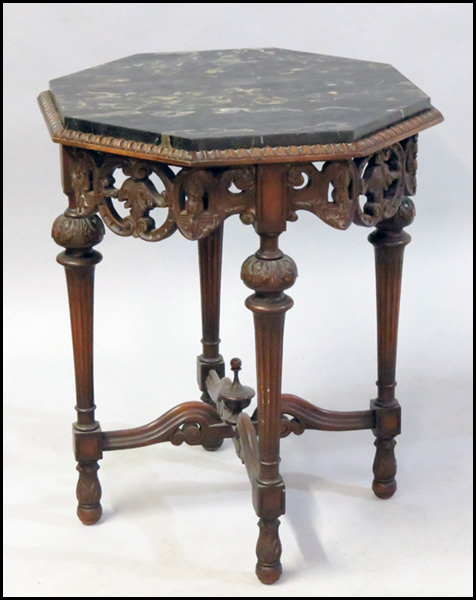 CARVED MAHOGANY OCTAGONAL TABLE.