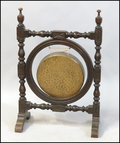 CARVED MAHOGANY AND BRASS GONG.