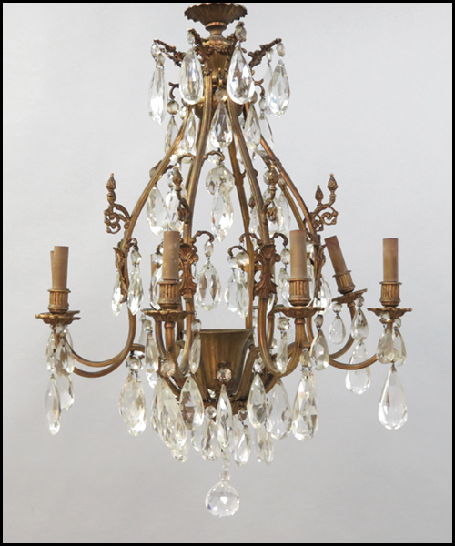 EIGHT-LIGHT BRONZE AND CRYSTAL CHANDELIER.