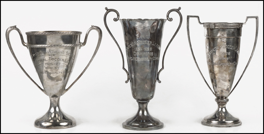 THREE SILVERPLATE SOCCER TROPHIES.