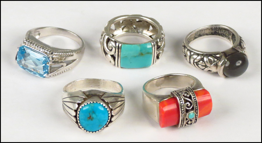 FIVE SILVER RINGS. Two turquoise