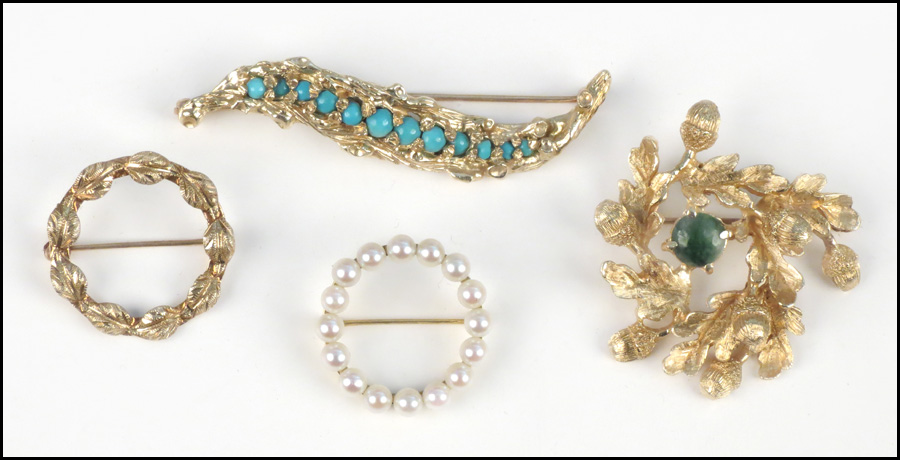 FOUR 14 KARAT YELLOW GOLD BROOCHES.