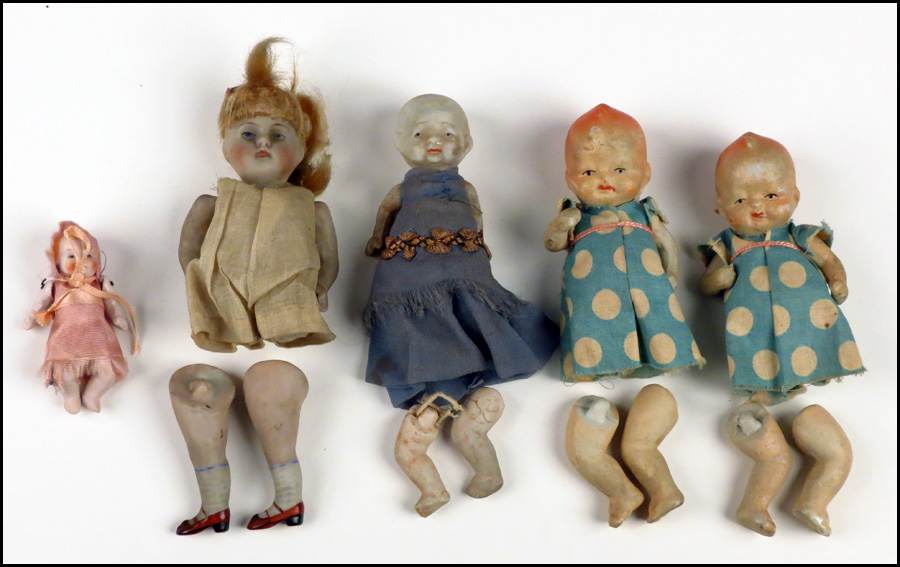 FIVE PORCELAIN DOLLS. Legs are