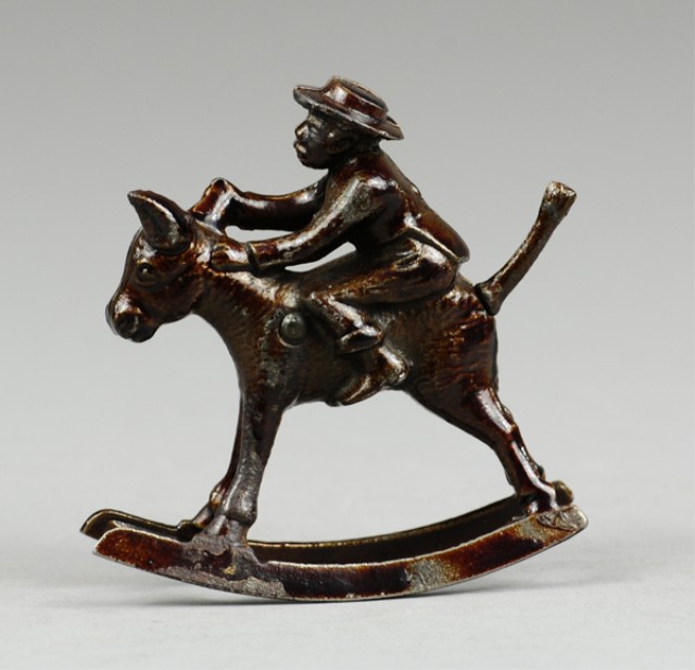 IVES BOY RIDING MULE Cast iron