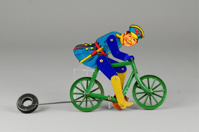 POLICEMAN ON BICYCLE STRING TOY