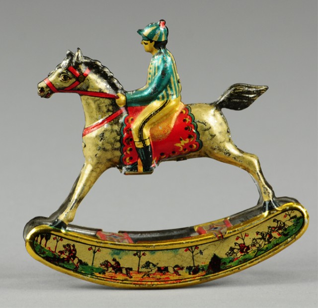 JOCKEY ON HORSE ROCKING PENNY TOY 178db1