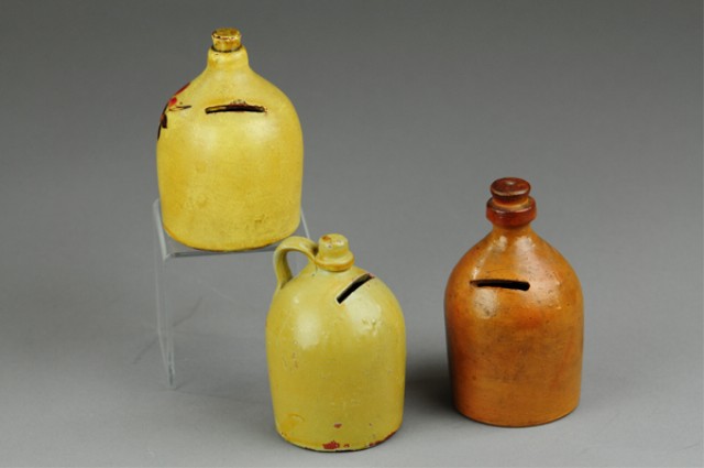 THREE POTTERY JUG STILL BANKS Includes