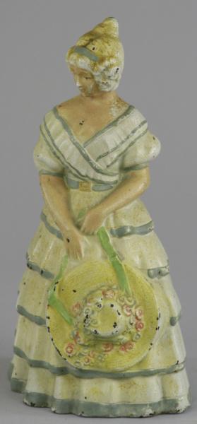 WOMAN HOLDING HAT DOORSTOP Possibly 17a825