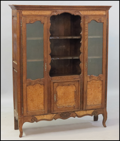 CARVED OAK CABINET. H: 67'' W: