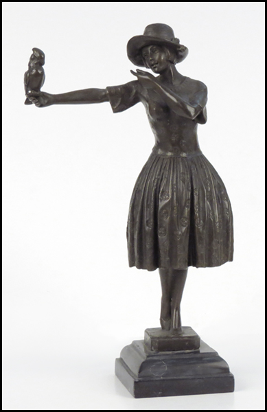 PATINATED BRONZE GIRL WITH A PARROT.