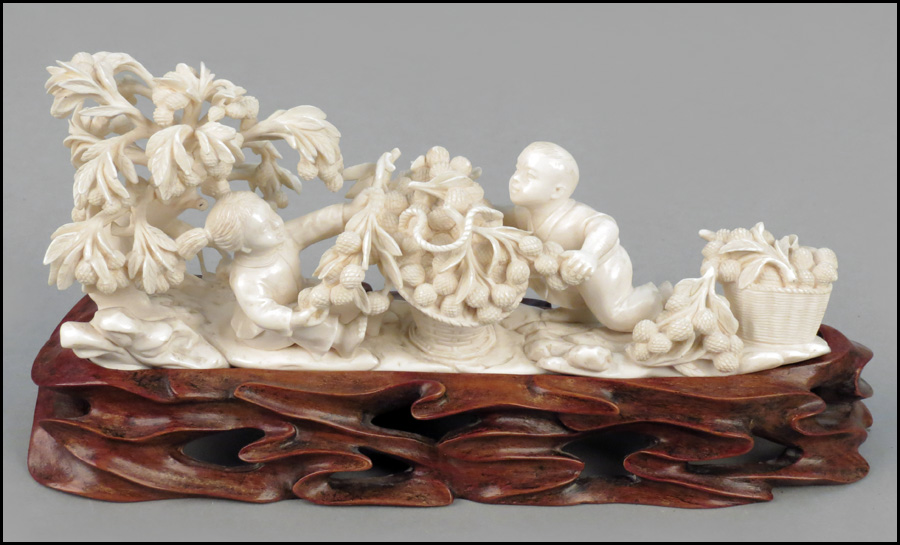 CARVED IVORY DEPICTING CHILDREN AT PLAY.
