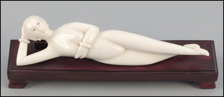 CARVED IVORY FIGURE OF A RECLINING 17af4c