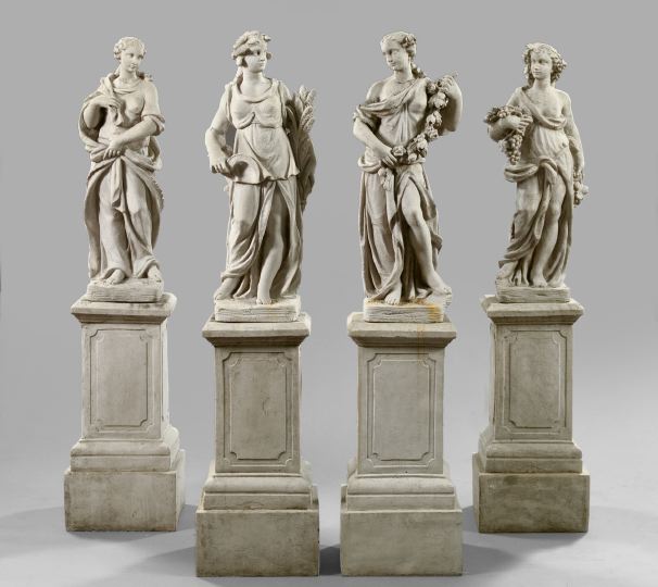 Suite of Four Composition Garden Figures-on-Stands,