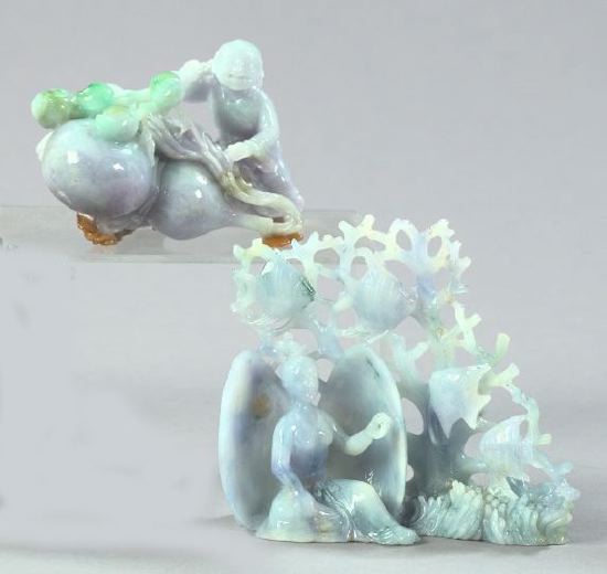 Two Carved Jade Figures,  the first