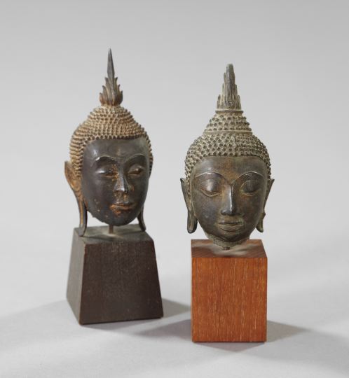 Near-Pair of Thai Parcel-Gilt Patinated