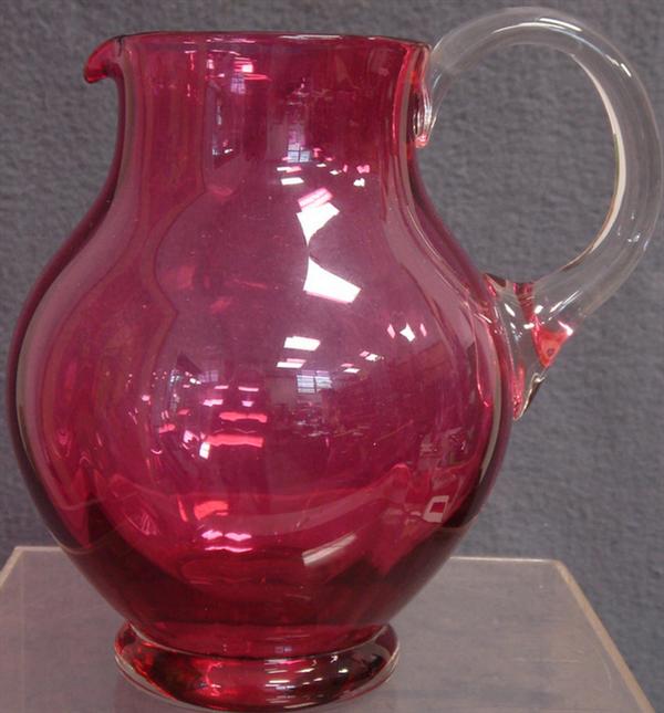 Cranberry glass pitcher, applied clear