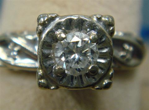 14 K WG filigree diamond ring,