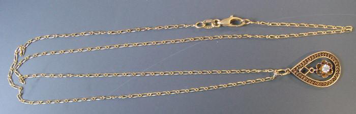 14K Diamond lavalier on 14K Chain.